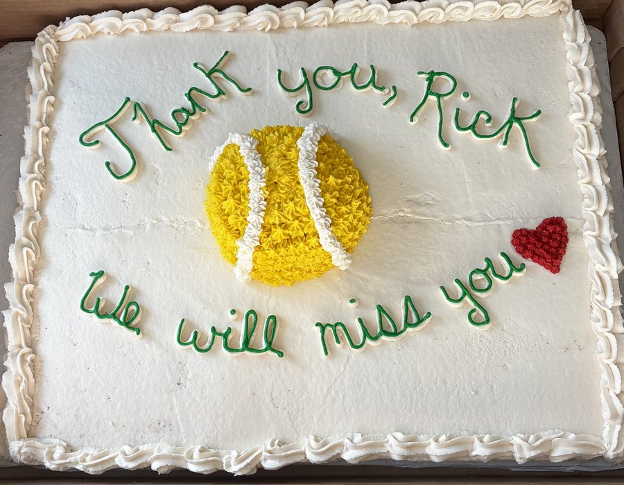 White retirement sheet cake with a yellow tennis ball, a red heart, and Thank you, We will miss you in green